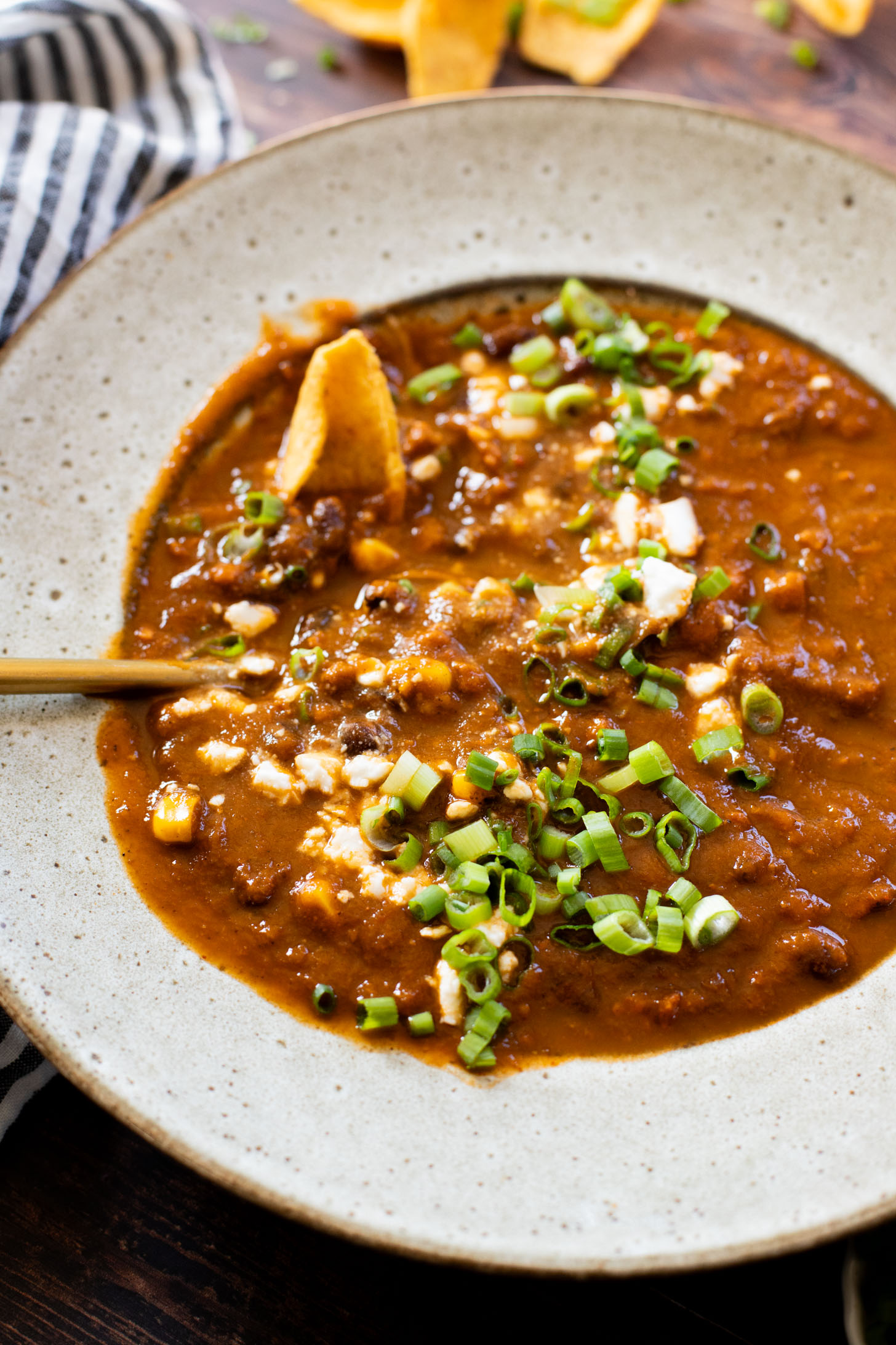 This Roasted Poblano Soup is made with simple ingredients and comes together quickly. Roasted veggies, crispy soyrizo & black beans | ThisSavoryVegan.com #thissavoryvegan #vegansoup #veggiesoup