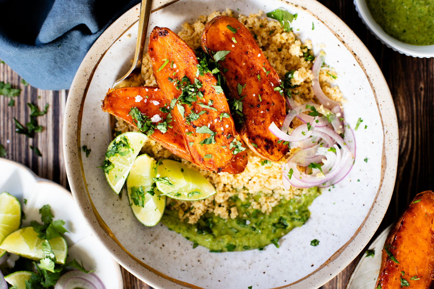 These Roasted Sweet Potato Bowls are layered with couscous, tender roasted sweet potatoes and an avocado cilantro sauce | ThisSavoryVegan.com #thissavoryvegan #grainbowl #veggiebowl