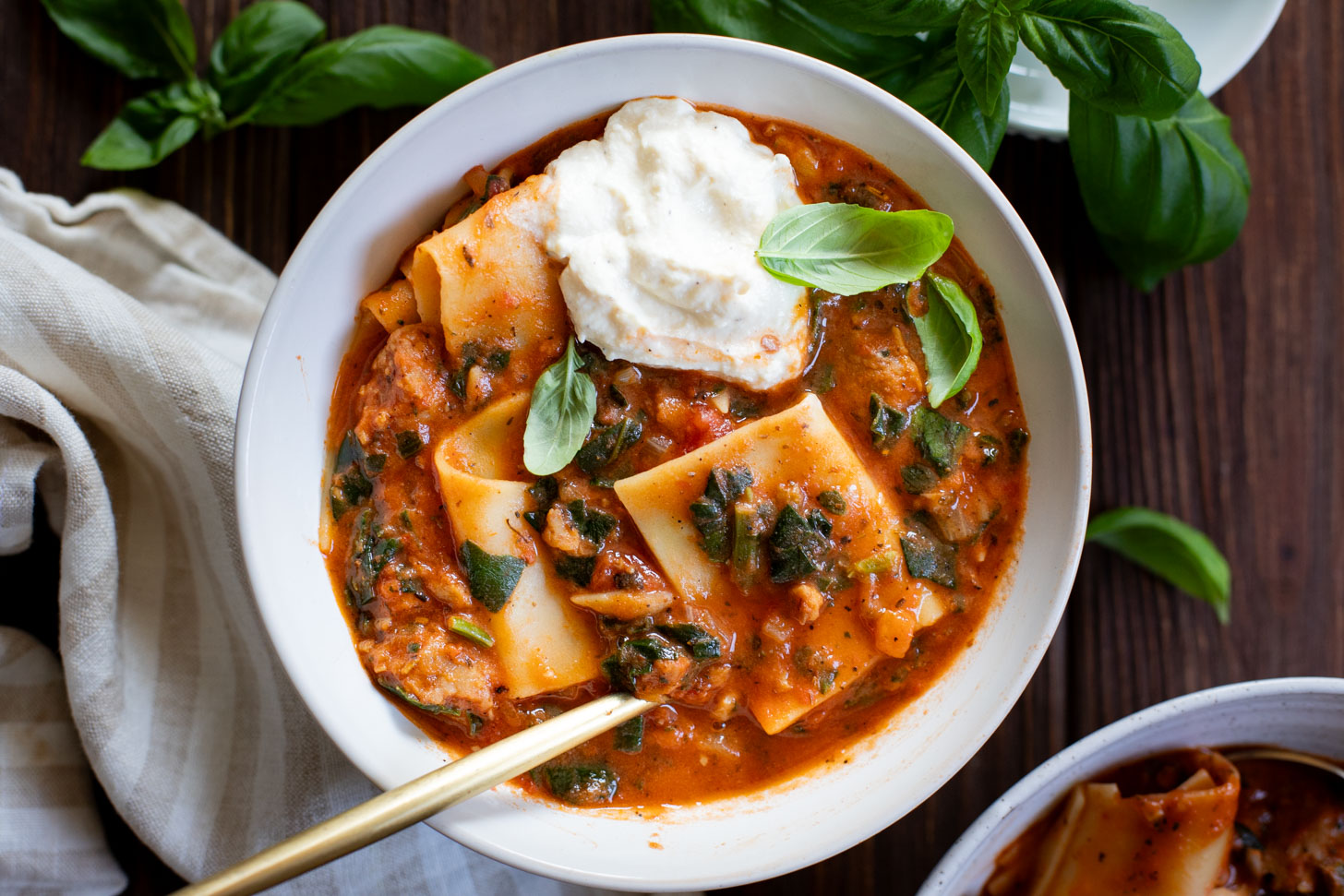 This Vegan Lasagna Soup is comfort food at its best. All the best flavors of lasagna made in one pot. Creamy marinara, vegan sausage, noodles & tofu ricotta | ThisSavoryVegan.com #thissavoryvegan #vegansoup #fallrecipes