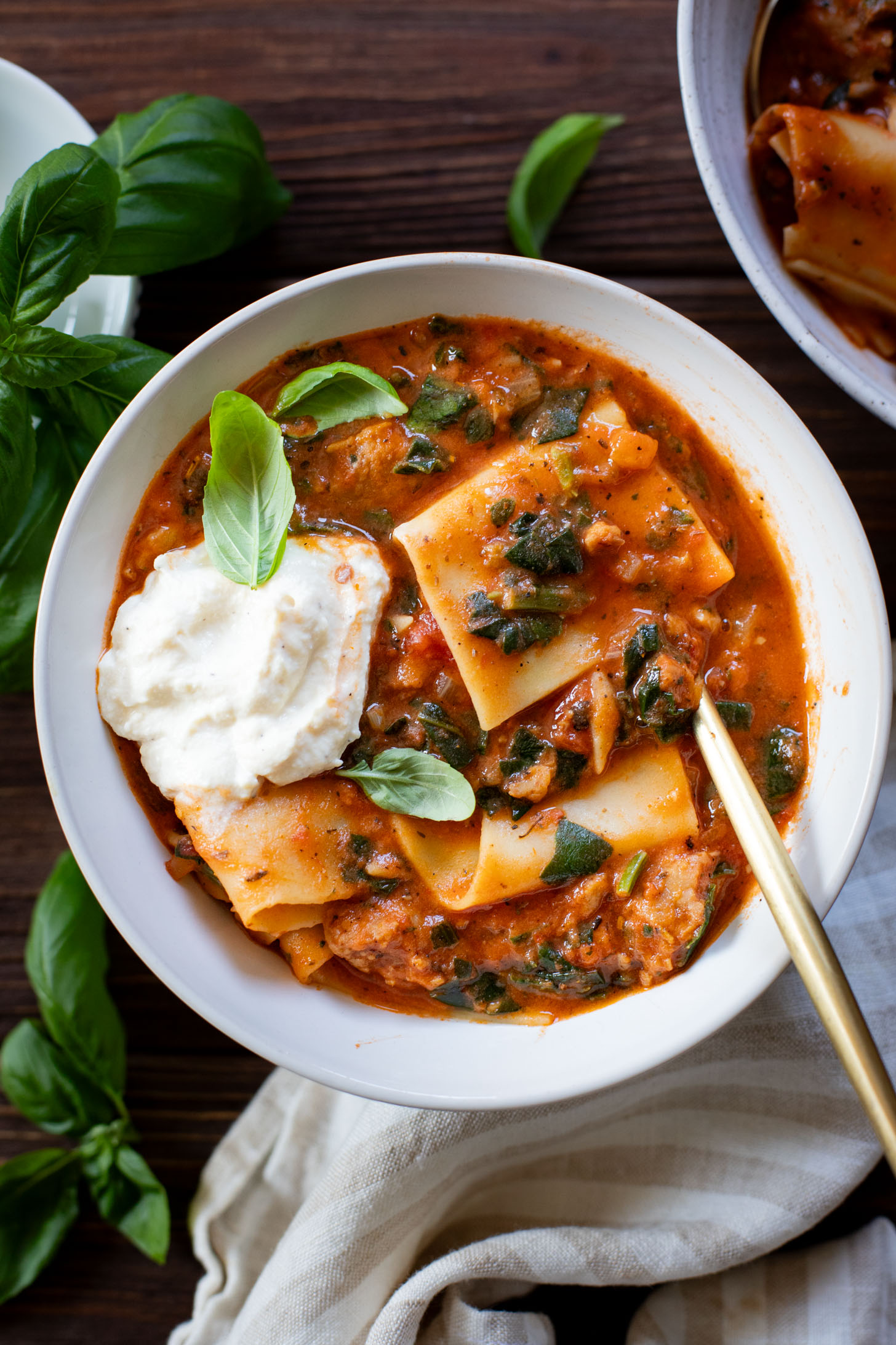 This Vegan Lasagna Soup is comfort food at its best. All the best flavors of lasagna made in one pot. Creamy marinara, vegan sausage, noodles & tofu ricotta | ThisSavoryVegan.com #thissavoryvegan #vegansoup #fallrecipes
