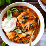 This Vegan Lasagna Soup is comfort food at its best. All the best flavors of lasagna made in one pot. Creamy marinara, vegan sausage, noodles & tofu ricotta | ThisSavoryVegan.com #thissavoryvegan #vegansoup #fallrecipes