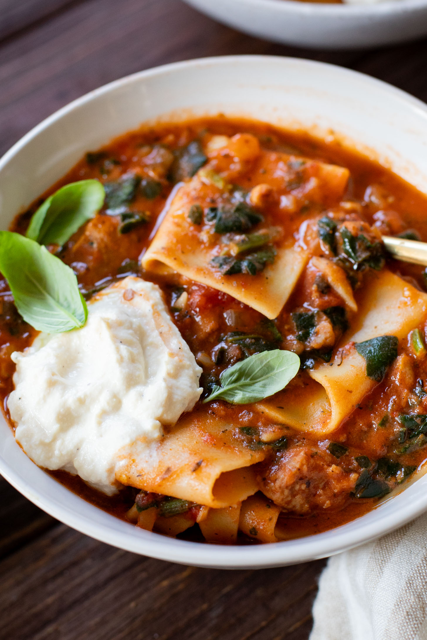 This Vegan Lasagna Soup is comfort food at its best. All the best flavors of lasagna made in one pot. Creamy marinara, vegan sausage, noodles & tofu ricotta | ThisSavoryVegan.com #thissavoryvegan #vegansoup #fallrecipes