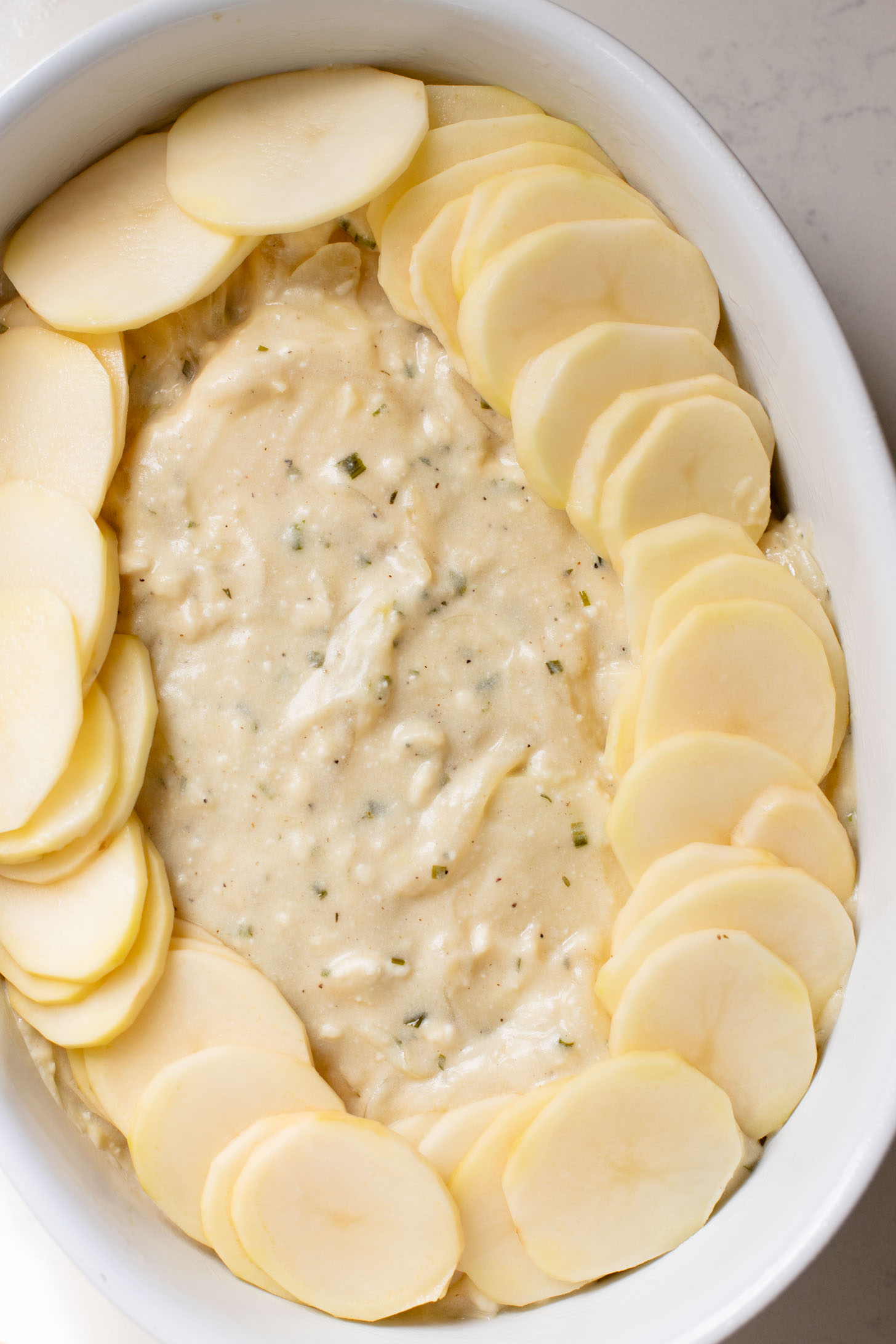 These Vegan Scalloped Potatoes are the perfect holiday side dish. Rich, creamy and 100% dairy free! A must make for your vegan Thanksgiving | ThisSavoryVegan.com #thissavoryvegan #veganthanksgiving #veganholidaysides