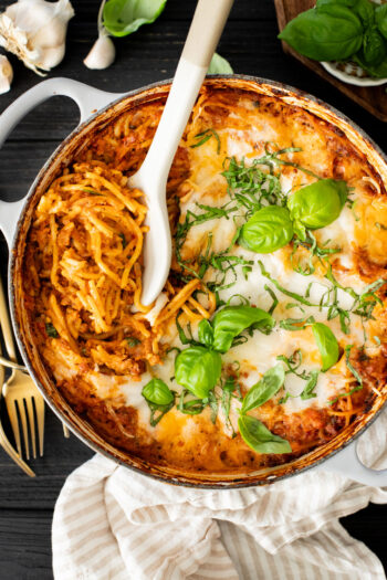 This Baked Spaghetti Bolognese is a one-pot vegan dinner that is comfort food at its best! Creamy pasta topped with melty vegan cheese | ThisSavoryVegan.com #pastabake #veganpasta #thissavoryvegan