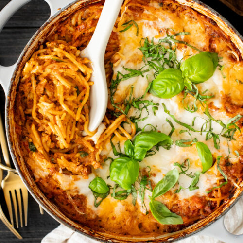 This Baked Spaghetti Bolognese is a one-pot vegan dinner that is comfort food at its best! Creamy pasta topped with melty vegan cheese | ThisSavoryVegan.com #pastabake #veganpasta #thissavoryvegan