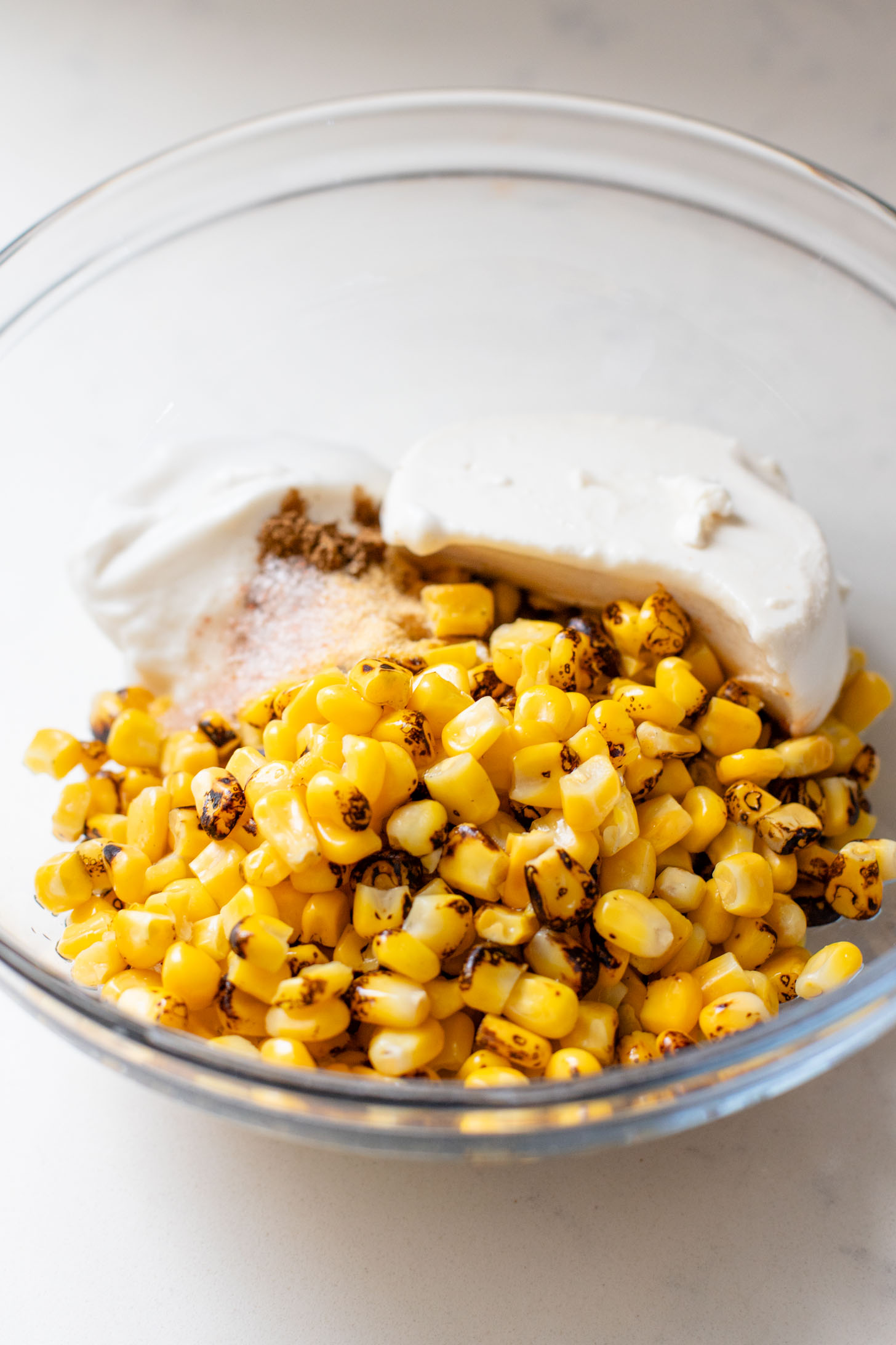 This Black Bean Tortilla Enchilada Rice Bake is a one-pot vegan dinner that is packed with veggies, rice, beans, corn salad and crispy tortillas | ThisSavoryVegan.com #thissavoryvegan #dumpandbake #vegancasserole