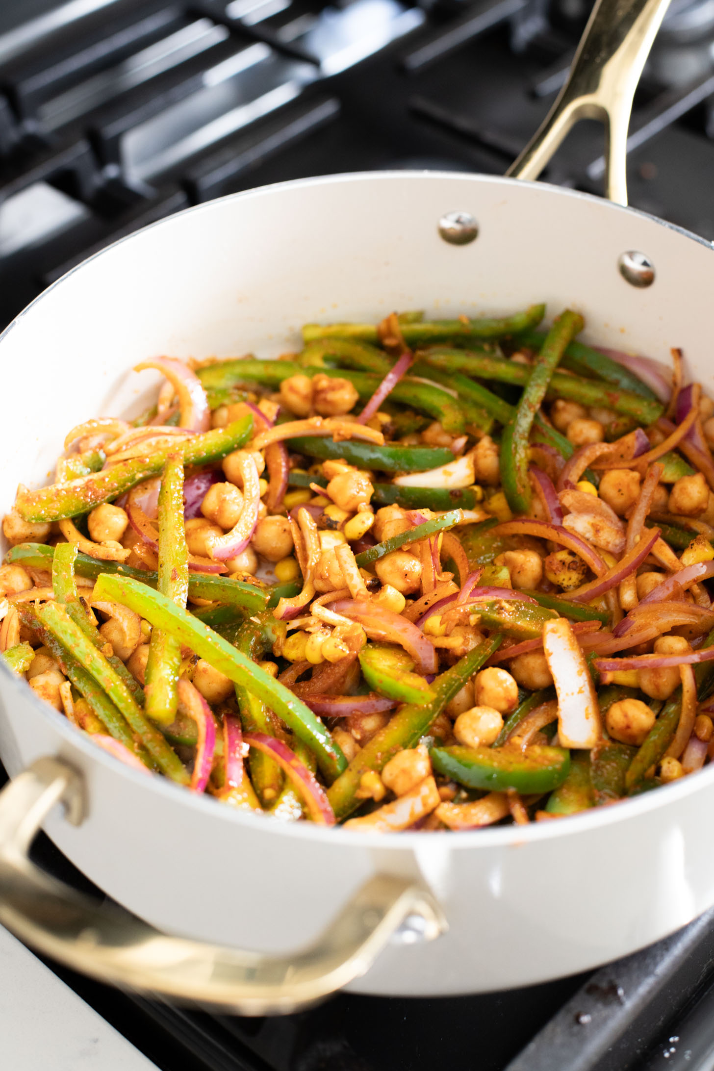 This Creamy Cajun Tofu Skillet is a comforting and veggie-packed skillet dinner. Made with a dairy-free cream sauce, crispy tofu, chickpeas & veggies | ThisSavoryVegan.com #thissavoryvegan #skilletdinners #easytofurecipes