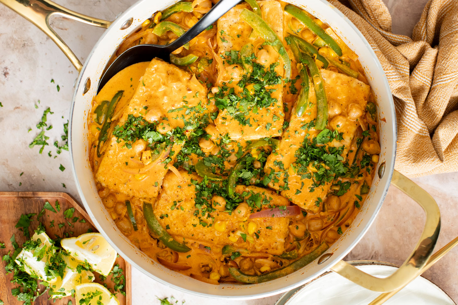 This Creamy Cajun Tofu Skillet is a comforting and veggie-packed skillet dinner. Made with a dairy-free cream sauce, crispy tofu, chickpeas & veggies | ThisSavoryVegan.com #thissavoryvegan #skilletdinners #easytofurecipes