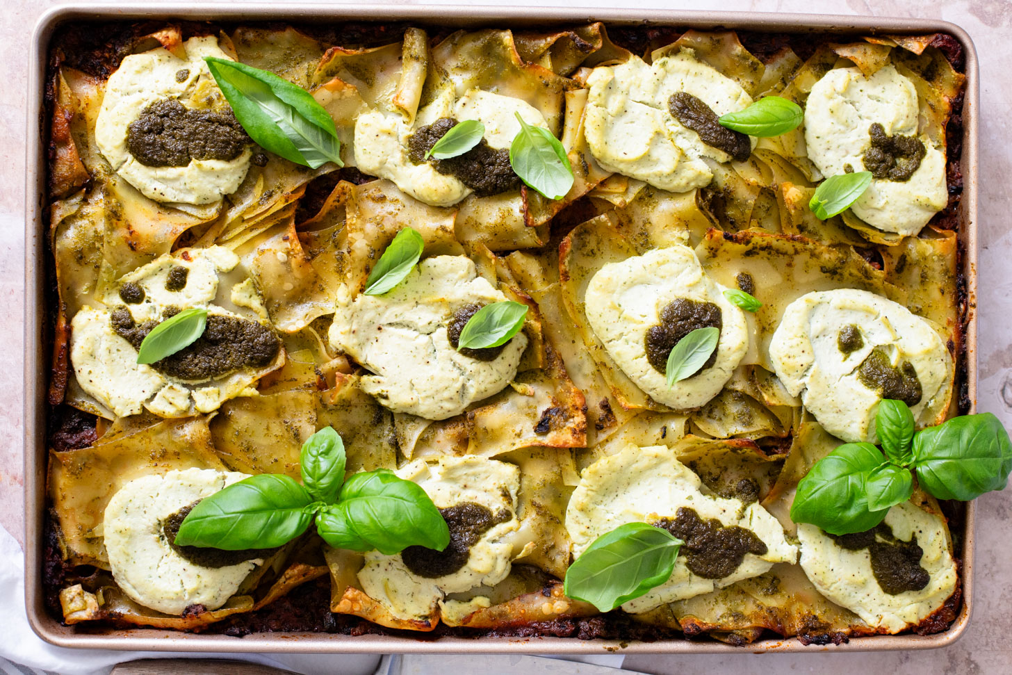 This Pesto Mushroom Sheet Pan Lasagna takes the work out of lasagna. A dairy-free lasagna recipe that doesn't skip on flavor | ThisSavoryVegan.com #thissavoryvegan #veganlasagna #veganpesto