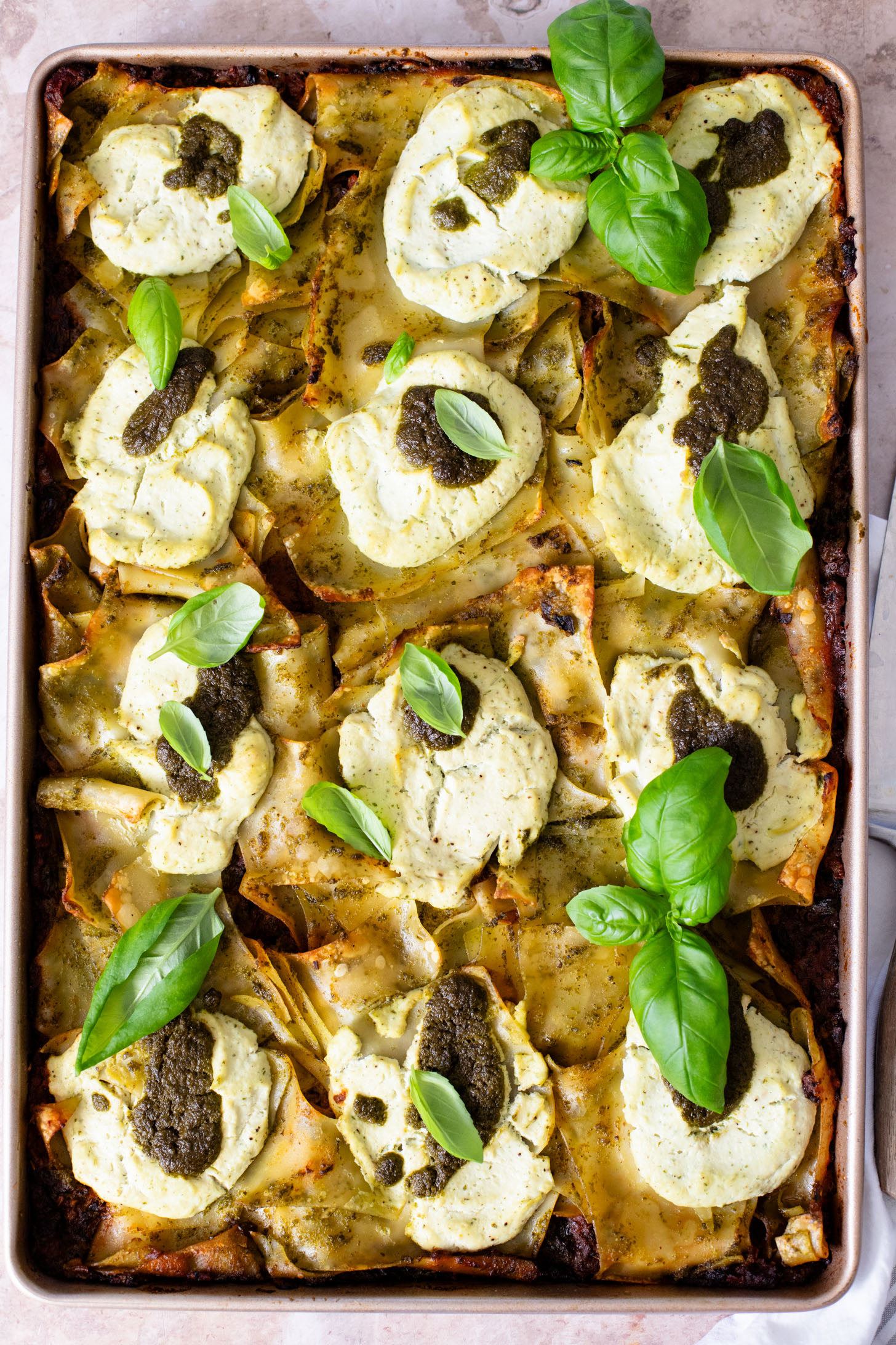 This Pesto Mushroom Sheet Pan Lasagna takes the work out of lasagna. A dairy-free lasagna recipe that doesn't skip on flavor | ThisSavoryVegan.com #thissavoryvegan #veganlasagna #veganpesto