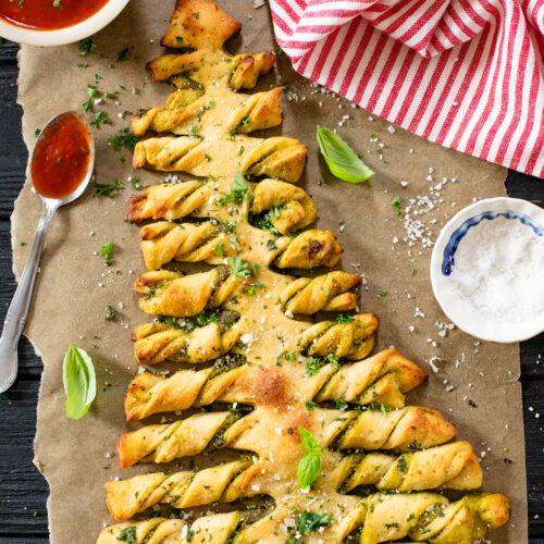 This Pesto Pull-Apart Christmas Tree is the best holiday appetizer! Filled with vegan pesto and topped with garlic butter | ThisSavoryVegan.com #christmasrecipes #christmasappetizers #holidaypartyfood