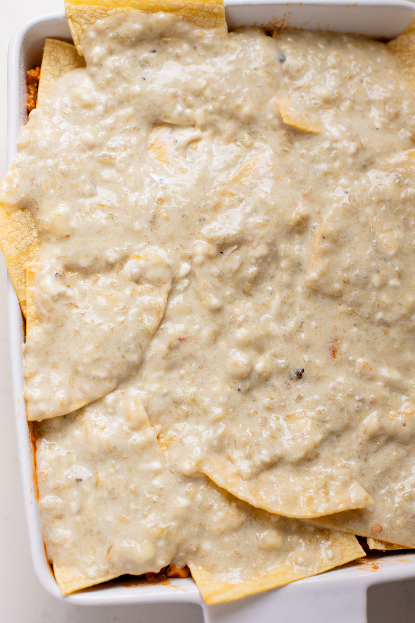 This Sweet Potato Quinoa Enchilada Bake is a simple weeknight dinner idea that is plant-based, easy and totally delicious | ThisSavoryVegan.com #thissavoryvegan #weeknightdinners #enchiladacasserole