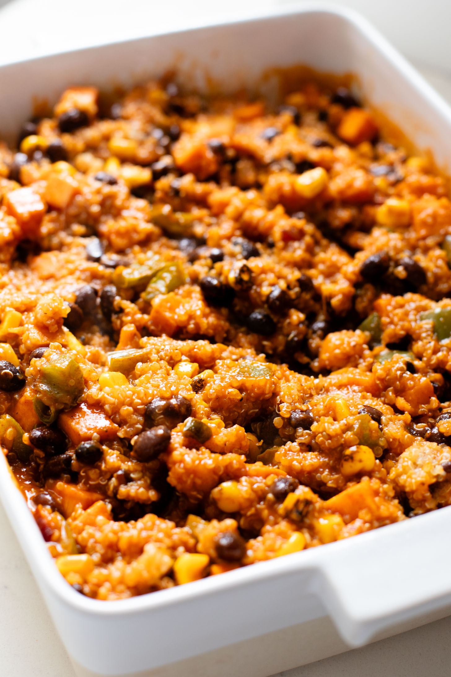 This Sweet Potato Quinoa Enchilada Bake is a simple weeknight dinner idea that is plant-based, easy and totally delicious | ThisSavoryVegan.com #thissavoryvegan #weeknightdinners #enchiladacasserole