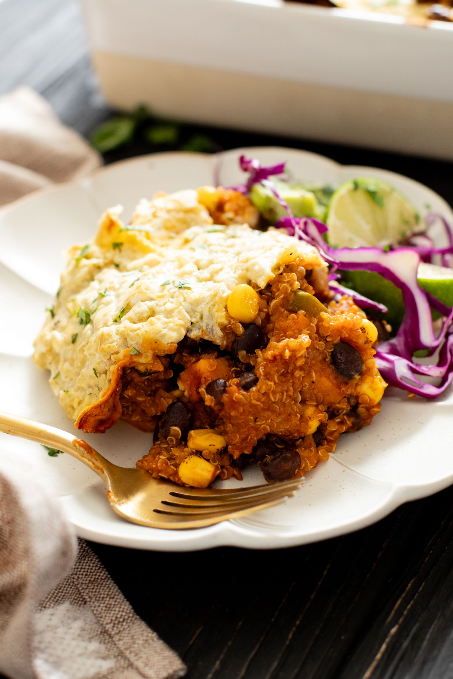 This Sweet Potato Quinoa Enchilada Bake is a simple weeknight dinner idea that is plant-based, easy and totally delicious | ThisSavoryVegan.com #thissavoryvegan #weeknightdinners #enchiladacasserole