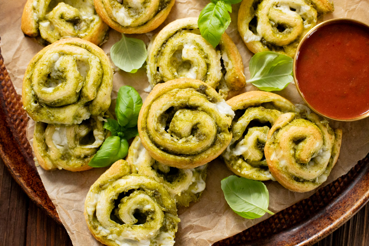 The perfect party appetizer, these Vegan Pesto & Feta Pinwheels only require 4 ingredients and 25 minutes. Tasty and simple | ThisSavoryVegan.com #thissavoryvegan #veganappetizers #holidayappetizers