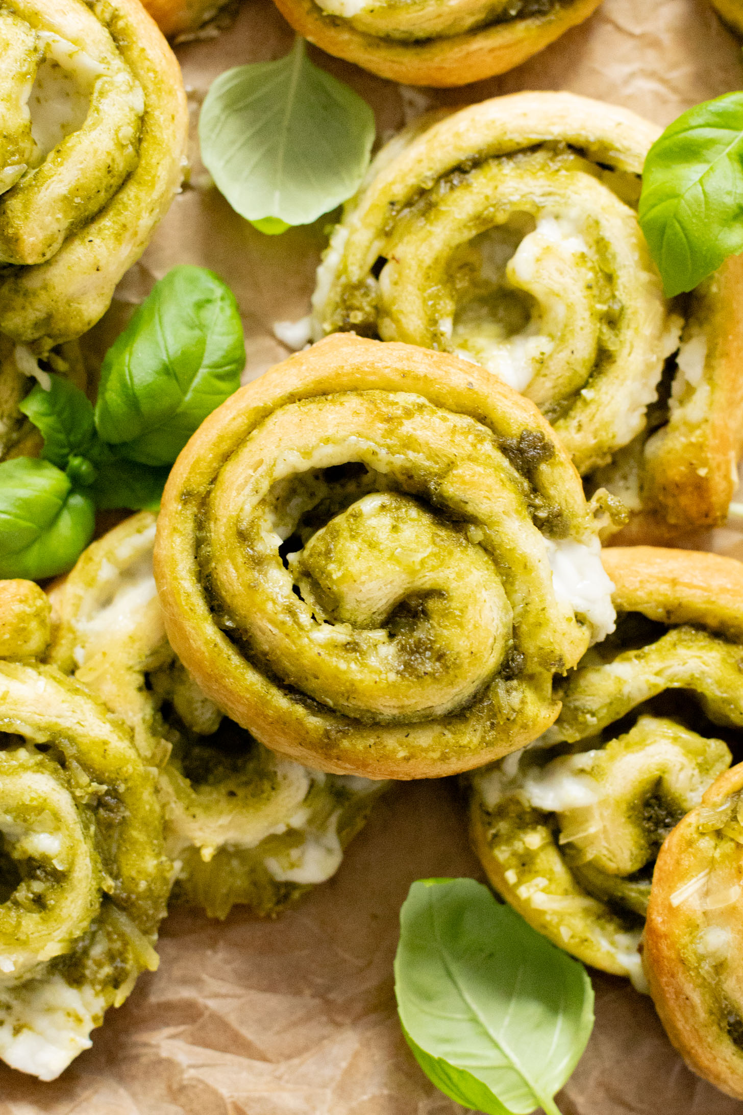 The perfect party appetizer, these Vegan Pesto & Feta Pinwheels only require 4 ingredients and 25 minutes. Tasty and simple | ThisSavoryVegan.com #thissavoryvegan #veganappetizers #holidayappetizers
