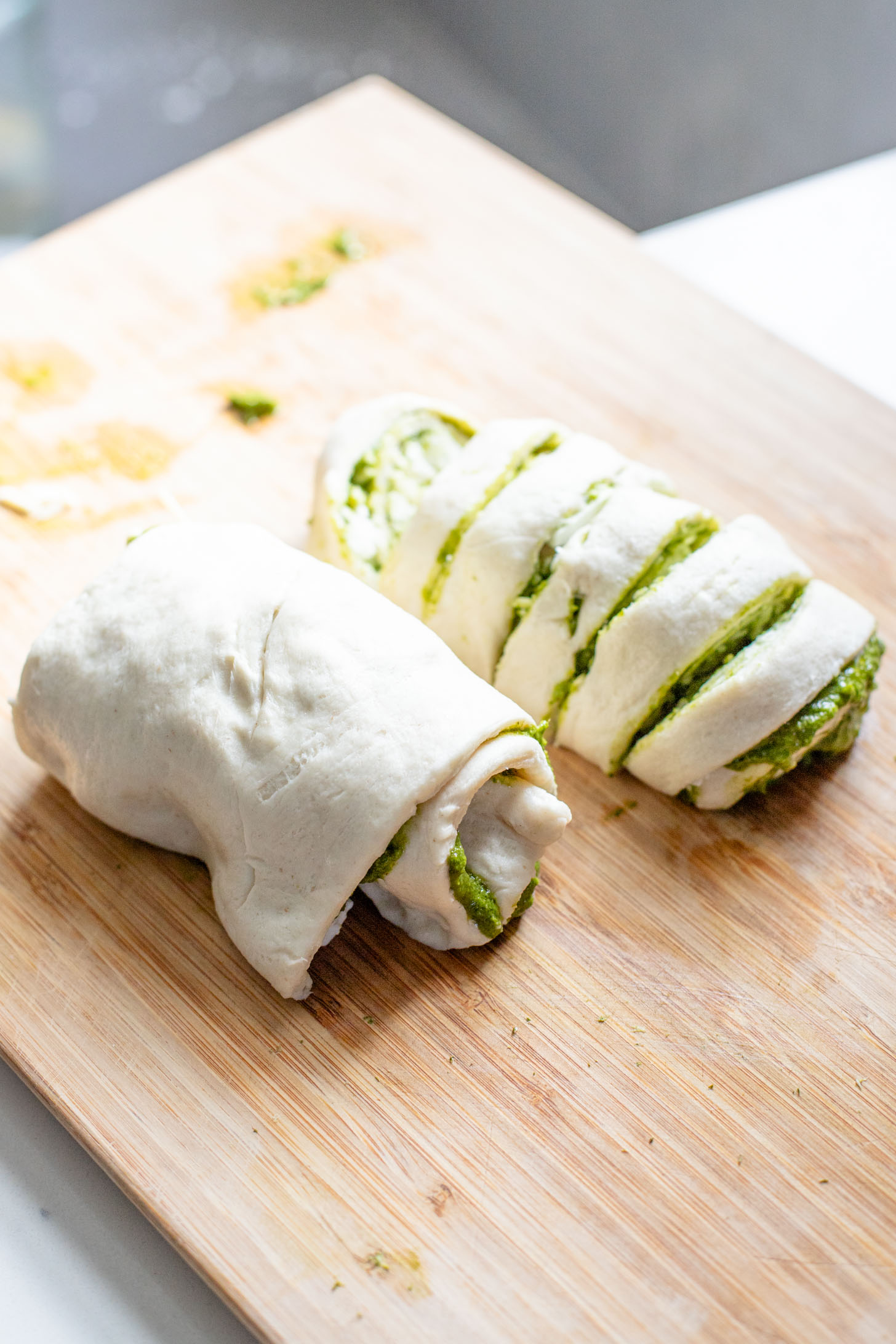 The perfect party appetizer, these Vegan Pesto & Feta Pinwheels only require 4 ingredients and 25 minutes. Tasty and simple | ThisSavoryVegan.com #thissavoryvegan #veganappetizers #holidayappetizers