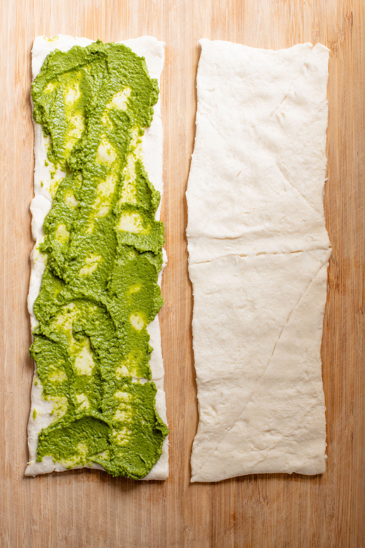 The perfect party appetizer, these Vegan Pesto & Feta Pinwheels only require 4 ingredients and 25 minutes. Tasty and simple | ThisSavoryVegan.com #thissavoryvegan #veganappetizers #holidayappetizers