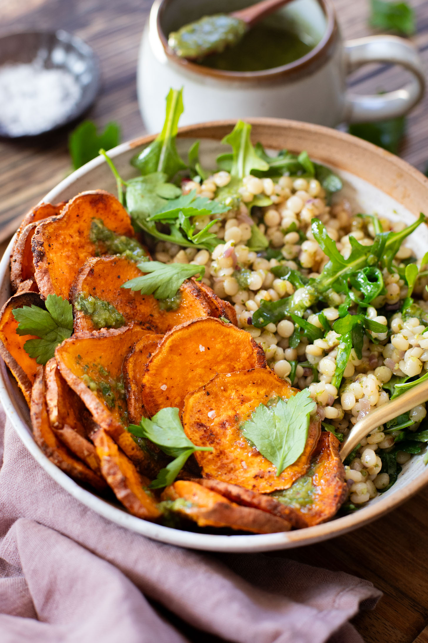 This Chimichurri Couscous & Roasted Sweet Potatoes recipe is healthy, comfort food. Pearl couscous tossed in homemade chimichurri & topped with seasoned sweet potatoes | ThisSavoryVegan.com #thissavoryvegan #couscousrecipes #roastedpotatoes
