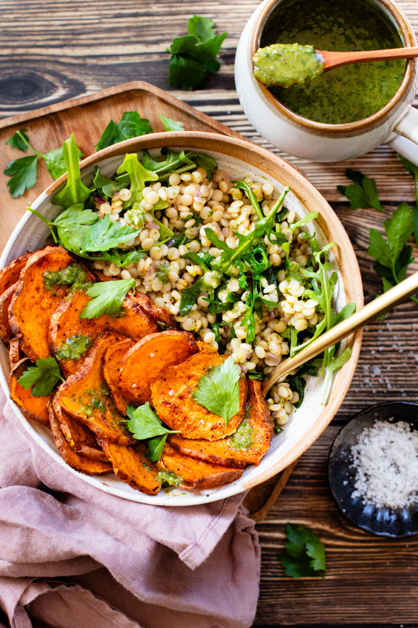 This Chimichurri Couscous & Roasted Sweet Potatoes recipe is healthy, comfort food. Pearl couscous tossed in homemade chimichurri & topped with seasoned sweet potatoes | ThisSavoryVegan.com #thissavoryvegan #couscousrecipes #roastedpotatoes