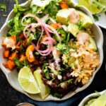 These Cauliflower Rice Sweet Potato Bowls are better tasting vegan Chipotle burrito bowls. A plant-based dinner everyone will love | ThisSavoryVegan.com #thissavoryvegan #grainbowls #veganchipotledupe