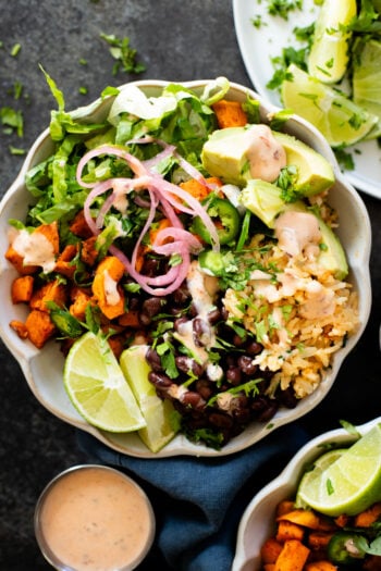 These Cauliflower Rice Sweet Potato Bowls are better tasting vegan Chipotle burrito bowls. A plant-based dinner everyone will love | ThisSavoryVegan.com #thissavoryvegan #grainbowls #veganchipotledupe