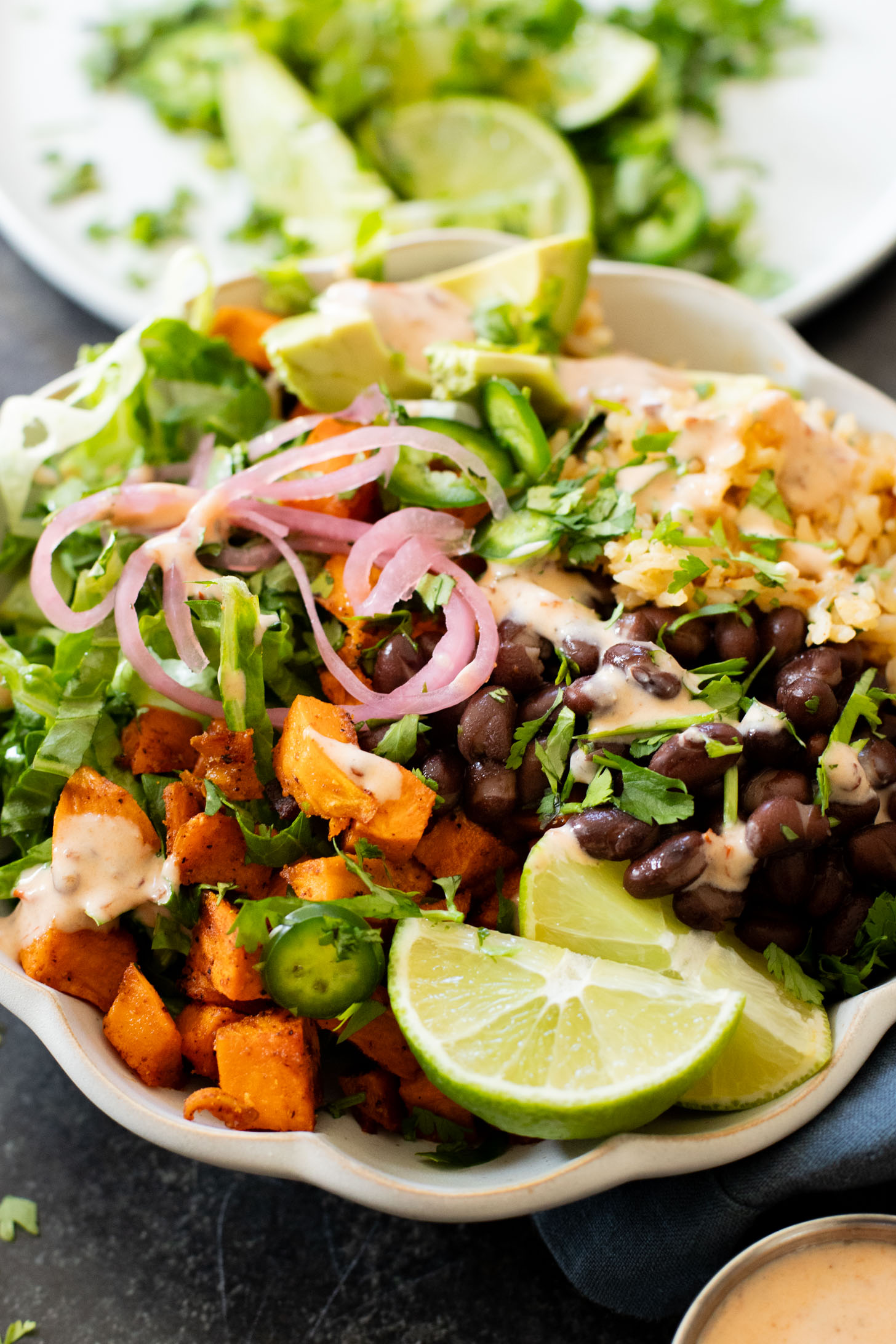 These Cauliflower Rice Sweet Potato Bowls are better tasting vegan Chipotle burrito bowls. A plant-based dinner everyone will love | ThisSavoryVegan.com #thissavoryvegan #grainbowls #veganchipotledupe