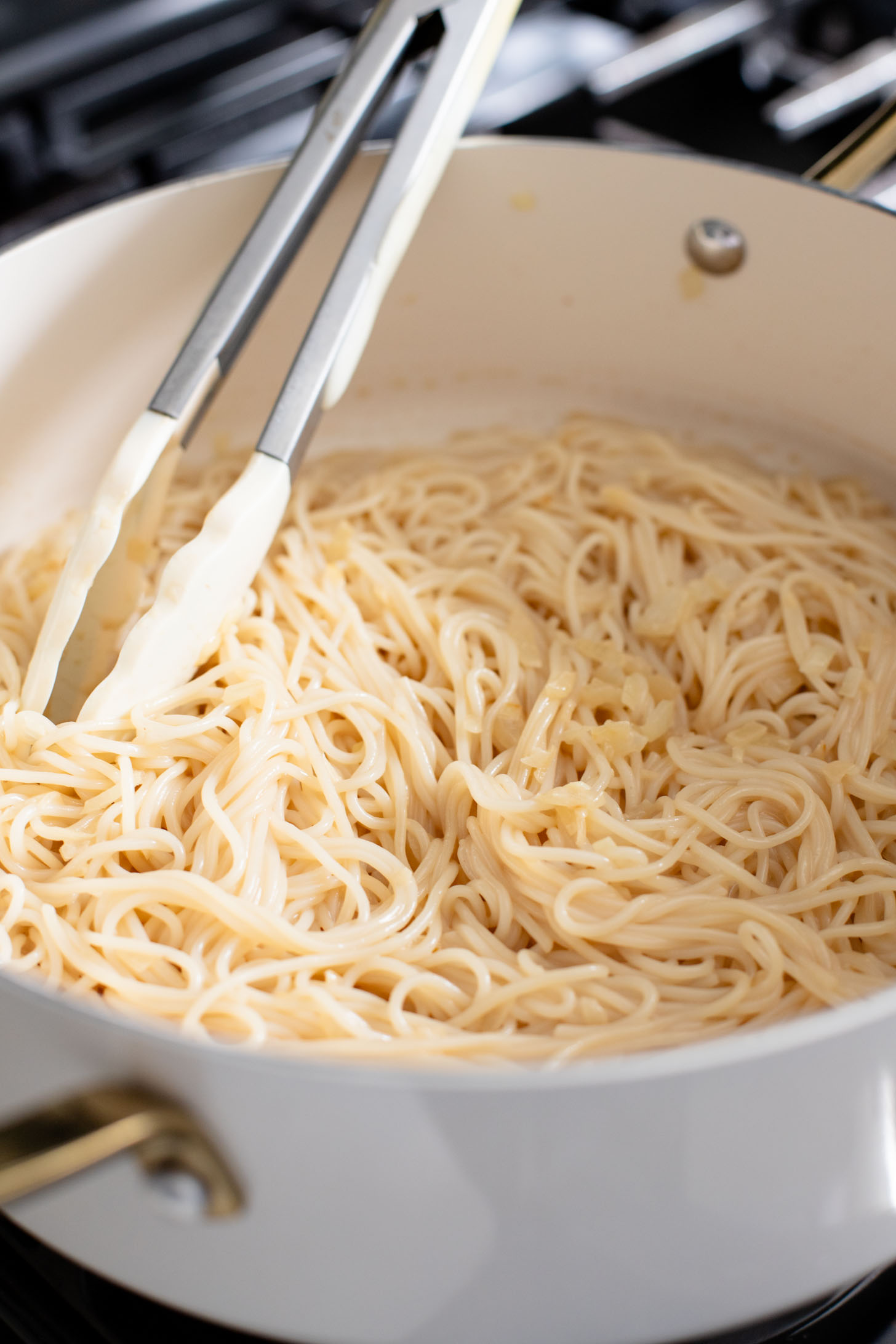 This Hoisin Cauliflower & Coconut Rice Noodles recipe is better than takeout! Coconut rice noodles are topped with crispy cauliflower & roasted brussels sprouts | ThisSavoryVegan.com #thissavoryvegan #cauliflowerrecipes #vegantakeoutrecipes
