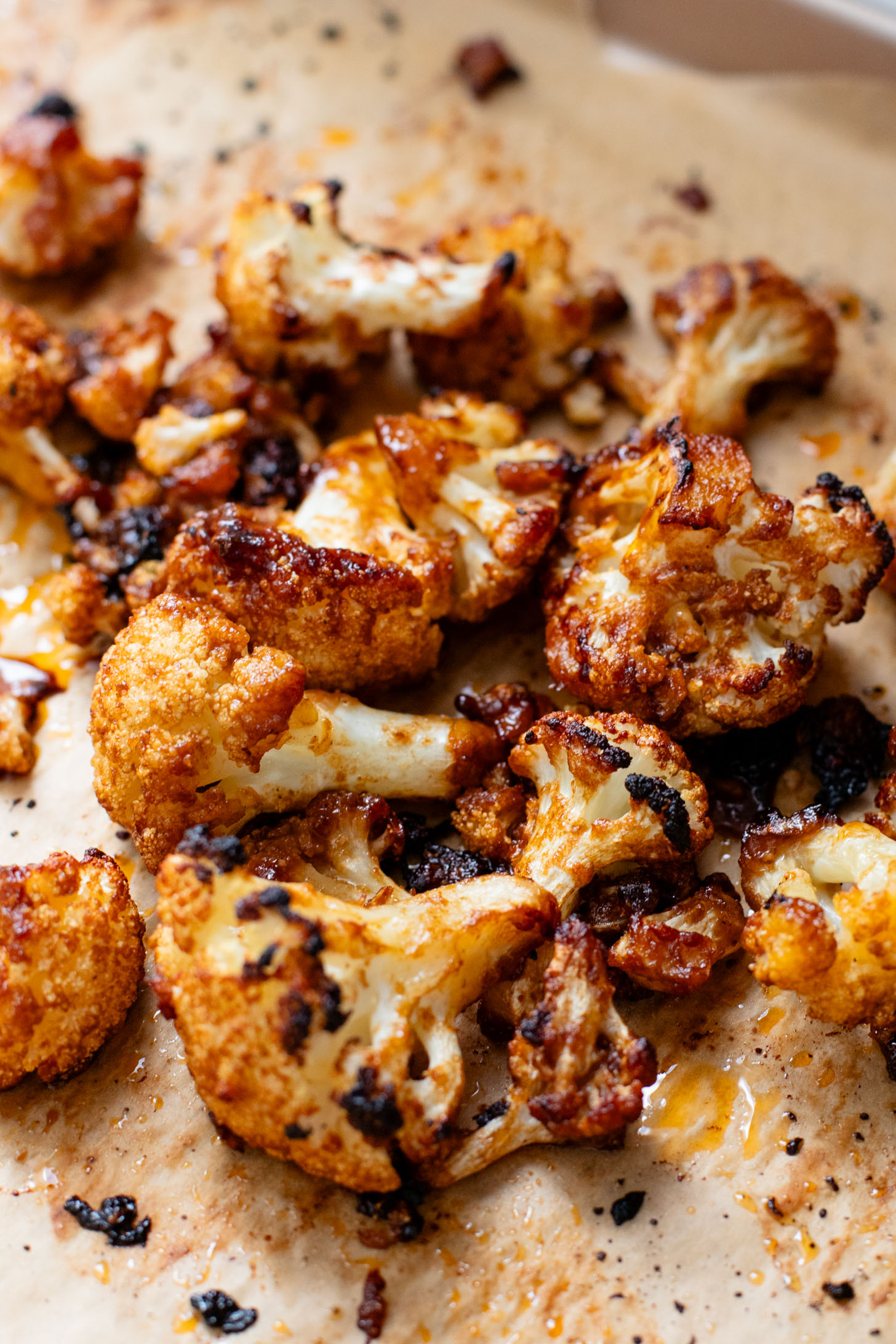 This Hoisin Cauliflower & Coconut Rice Noodles recipe is better than takeout! Coconut rice noodles are topped with crispy cauliflower & roasted brussels sprouts | ThisSavoryVegan.com #thissavoryvegan #cauliflowerrecipes #vegantakeoutrecipes