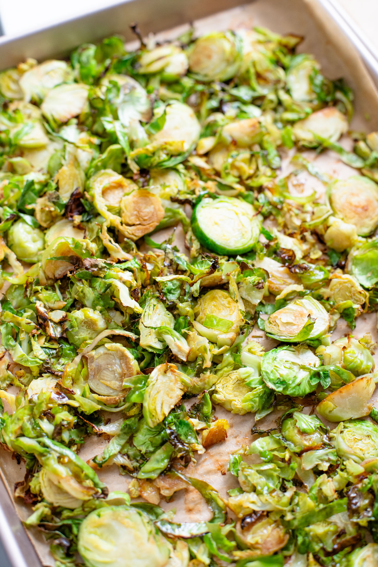 This Hoisin Cauliflower & Coconut Rice Noodles recipe is better than takeout! Coconut rice noodles are topped with crispy cauliflower & roasted brussels sprouts | ThisSavoryVegan.com #thissavoryvegan #cauliflowerrecipes #vegantakeoutrecipes