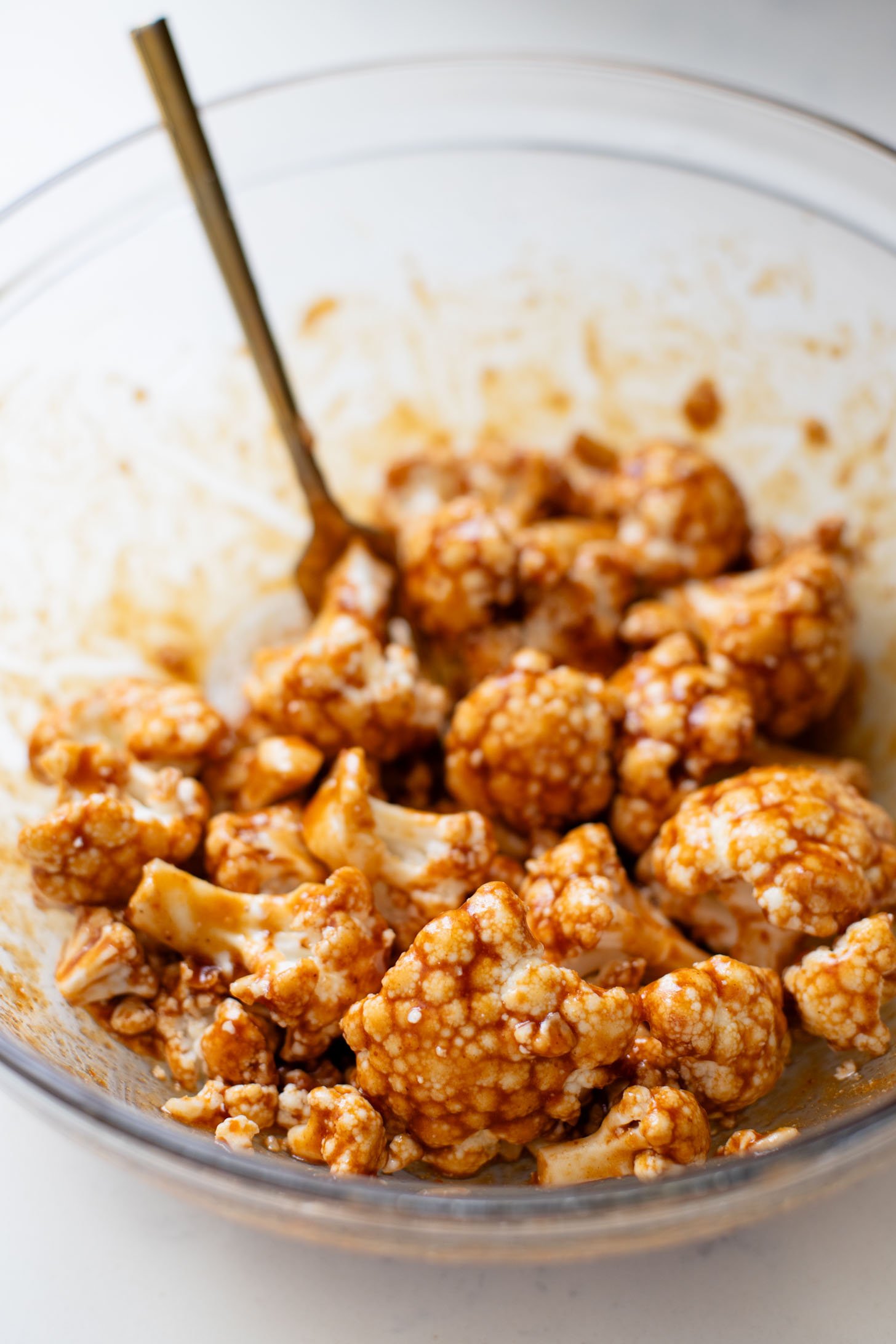 This Hoisin Cauliflower & Coconut Rice Noodles recipe is better than takeout! Coconut rice noodles are topped with crispy cauliflower & roasted brussels sprouts | ThisSavoryVegan.com #thissavoryvegan #cauliflowerrecipes #vegantakeoutrecipes