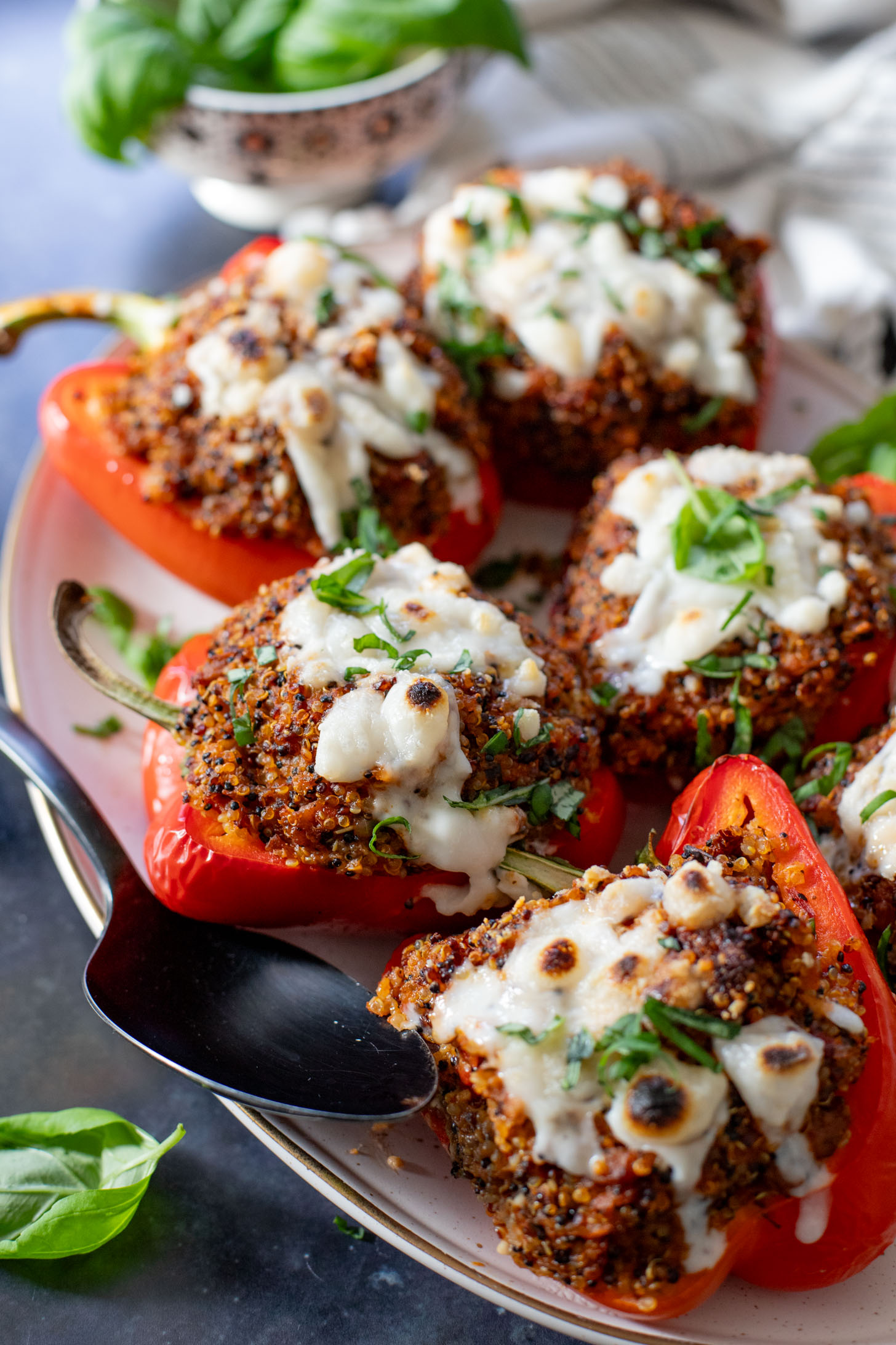 These Mediterranean Quinoa Stuffed Peppers are loaded with quinoa, vegan sausage & non-dairy feta. A delicious and veggie-packed vegan dinner | ThisSavoryVegan.com #thissavoryvegan #stuffedpeppers #highproteinveganrecipes