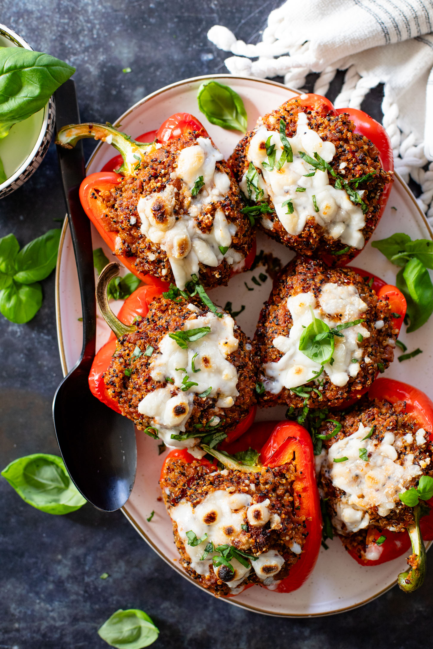 These Mediterranean Quinoa Stuffed Peppers are loaded with quinoa, vegan sausage & non-dairy feta. A delicious and veggie-packed vegan dinner | ThisSavoryVegan.com #thissavoryvegan #stuffedpeppers #highproteinveganrecipes
