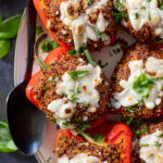 These Mediterranean Quinoa Stuffed Peppers are loaded with quinoa, vegan sausage & non-dairy feta. A delicious and veggie-packed vegan dinner | ThisSavoryVegan.com #thissavoryvegan #stuffedpeppers #highproteinveganrecipes
