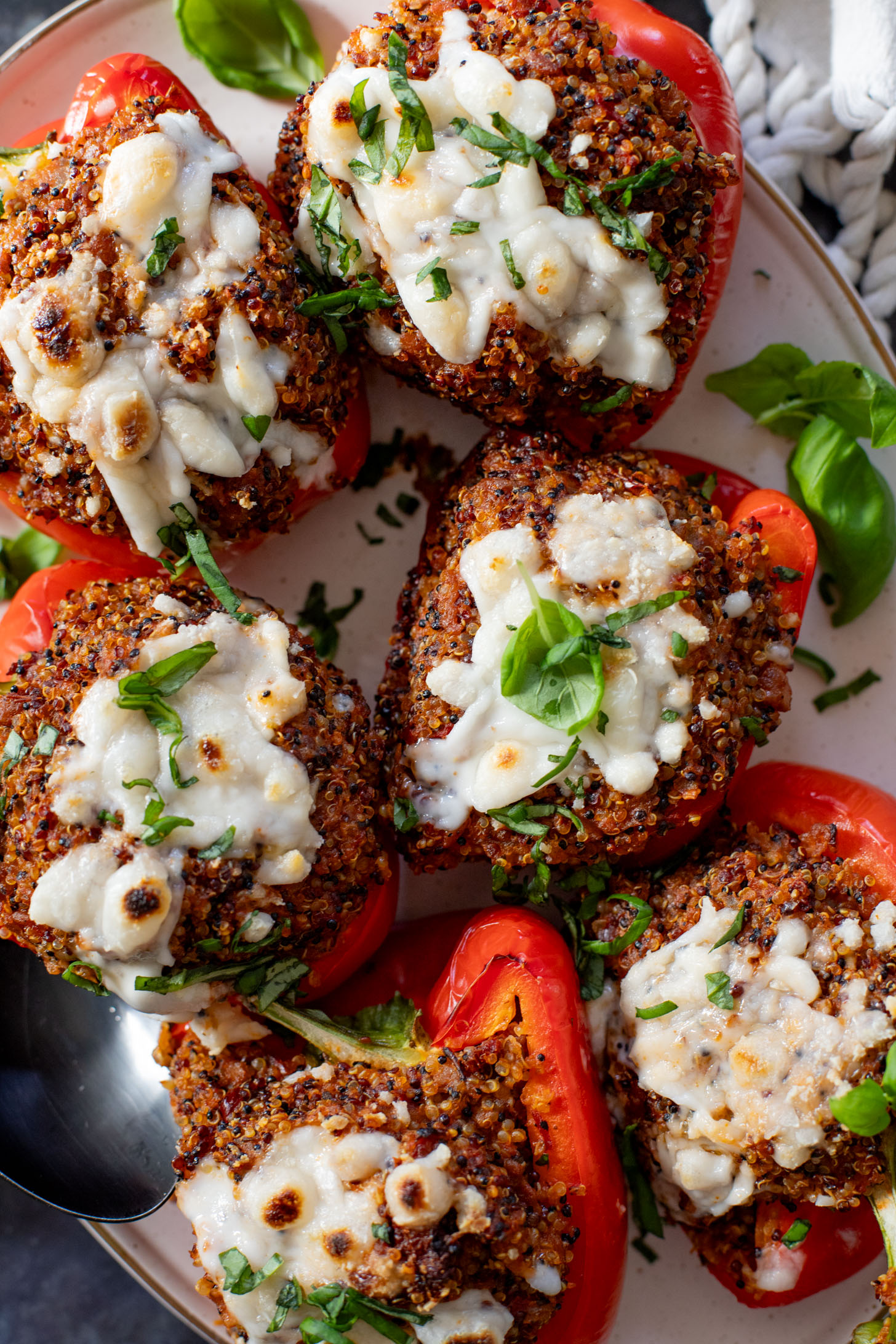 These Mediterranean Quinoa Stuffed Peppers are loaded with quinoa, vegan sausage & non-dairy feta. A delicious and veggie-packed vegan dinner | ThisSavoryVegan.com #thissavoryvegan #stuffedpeppers #highproteinveganrecipes