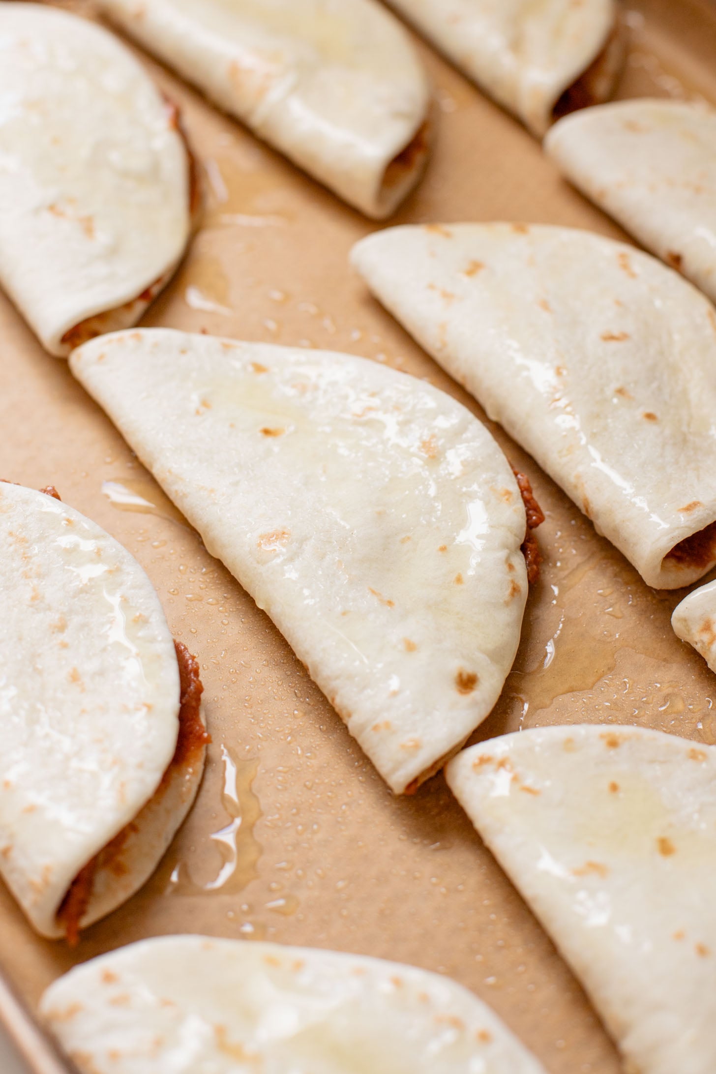 These Mini Refried Bean Tacos are INCREDIBLY simple to make, so tasty and perfect for an easy dinner or game day snack | ThisSavoryVegan.com #thissavoryvegan #vegantacos #gamedaysnacks