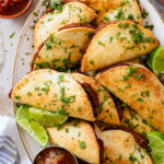These Mini Refried Bean Tacos are INCREDIBLY simple to make, so tasty and perfect for an easy dinner or game day snack | ThisSavoryVegan.com #thissavoryvegan #vegantacos #gamedaysnacks