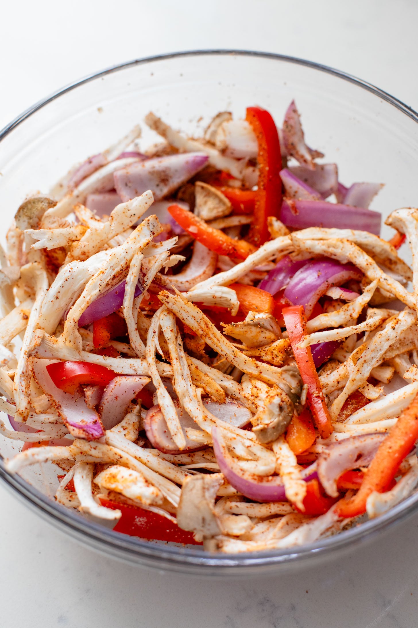 These Oyster Mushroom BBQ Tacos are vegan taco goals! Shredded mushrooms are tossed in BBQ sauce & topped with vegan slaw & avocado | ThisSavoryVegan.com #thissavoryvegan #vegantacos #mushroomtacos