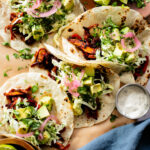 These Oyster Mushroom BBQ Tacos are vegan taco goals! Shredded mushrooms are tossed in BBQ sauce & topped with vegan slaw & avocado | ThisSavoryVegan.com #thissavoryvegan #vegantacos #mushroomtacos