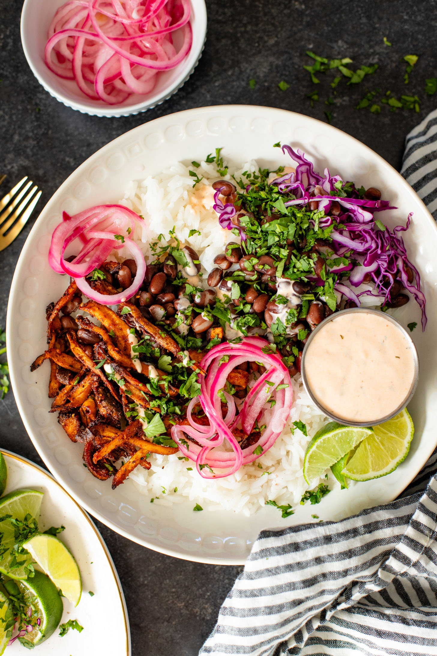 These Oyster Mushroom Burrito Bowls are made with shredded crispy king oyster mushrooms, rice, beans & chipotle ranch | ThisSavoryVegan.com #thissavoryvegan #veganburritobowls #mushroomrecipes