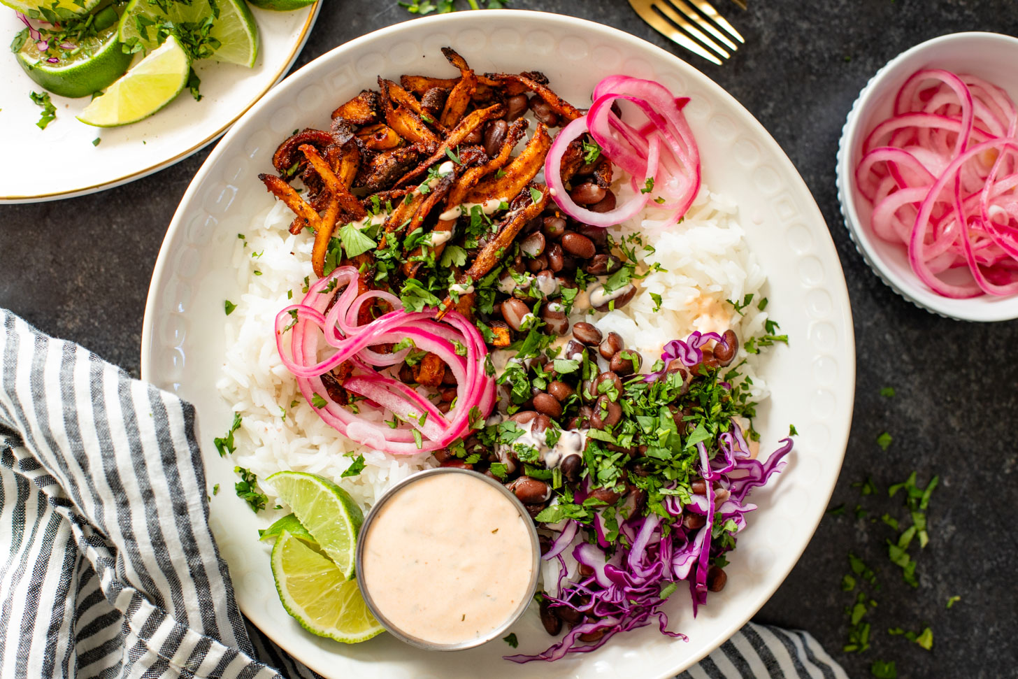 These Oyster Mushroom Burrito Bowls are made with shredded crispy king oyster mushrooms, rice, beans & chipotle ranch | ThisSavoryVegan.com #thissavoryvegan #veganburritobowls #mushroomrecipes