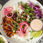 These Oyster Mushroom Burrito Bowls are made with shredded crispy king oyster mushrooms, rice, beans & chipotle ranch | ThisSavoryVegan.com #thissavoryvegan #veganburritobowls #mushroomrecipes