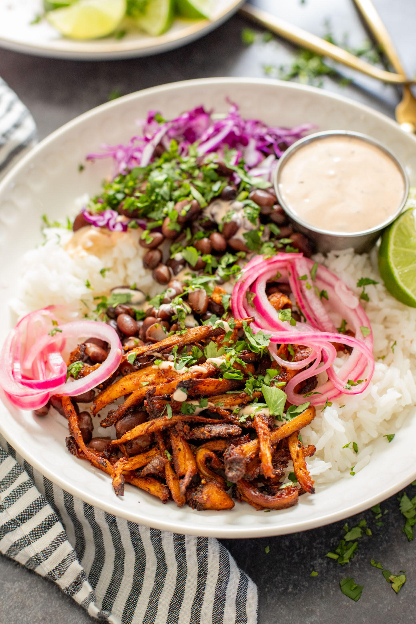 These Oyster Mushroom Burrito Bowls are made with shredded crispy king oyster mushrooms, rice, beans & chipotle ranch | ThisSavoryVegan.com #thissavoryvegan #veganburritobowls #mushroomrecipes