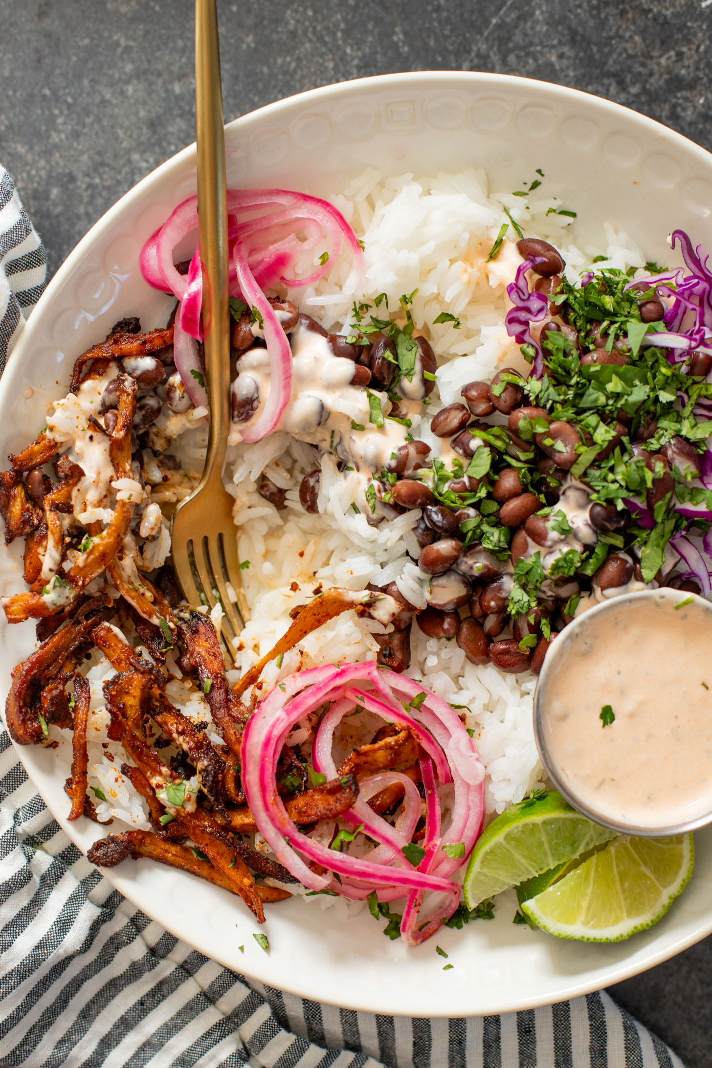 These Oyster Mushroom Burrito Bowls are made with shredded crispy king oyster mushrooms, rice, beans & chipotle ranch | ThisSavoryVegan.com #thissavoryvegan #veganburritobowls #mushroomrecipes