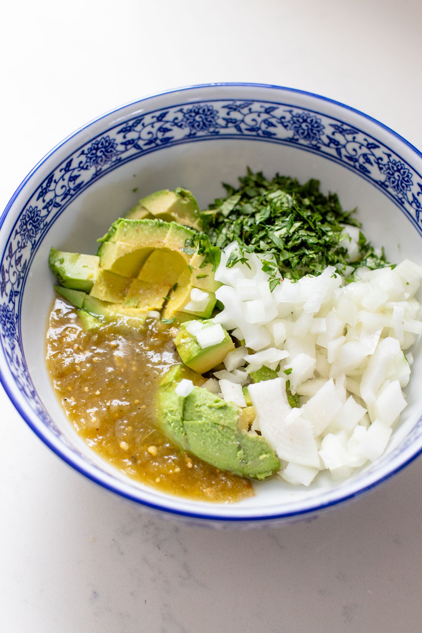 These Soy Chorizo & Potato Tostadas are made with refried beans, crispy potatoes, soyrizo and a salsa verde avocado salsa | ThisSavoryVegan.com #thissavoryvegan #vegantostadas #veganmexicanfood