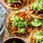 These Soy Chorizo & Potato Tostadas are made with refried beans, crispy potatoes, soyrizo and a salsa verde avocado salsa | ThisSavoryVegan.com #thissavoryvegan #vegantostadas #veganmexicanfood