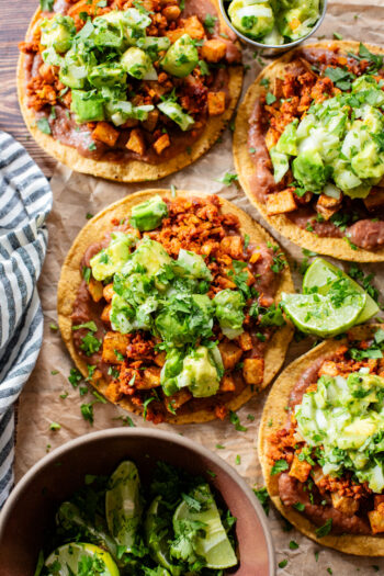 These Soy Chorizo & Potato Tostadas are made with refried beans, crispy potatoes, soyrizo and a salsa verde avocado salsa | ThisSavoryVegan.com #thissavoryvegan #vegantostadas #veganmexicanfood