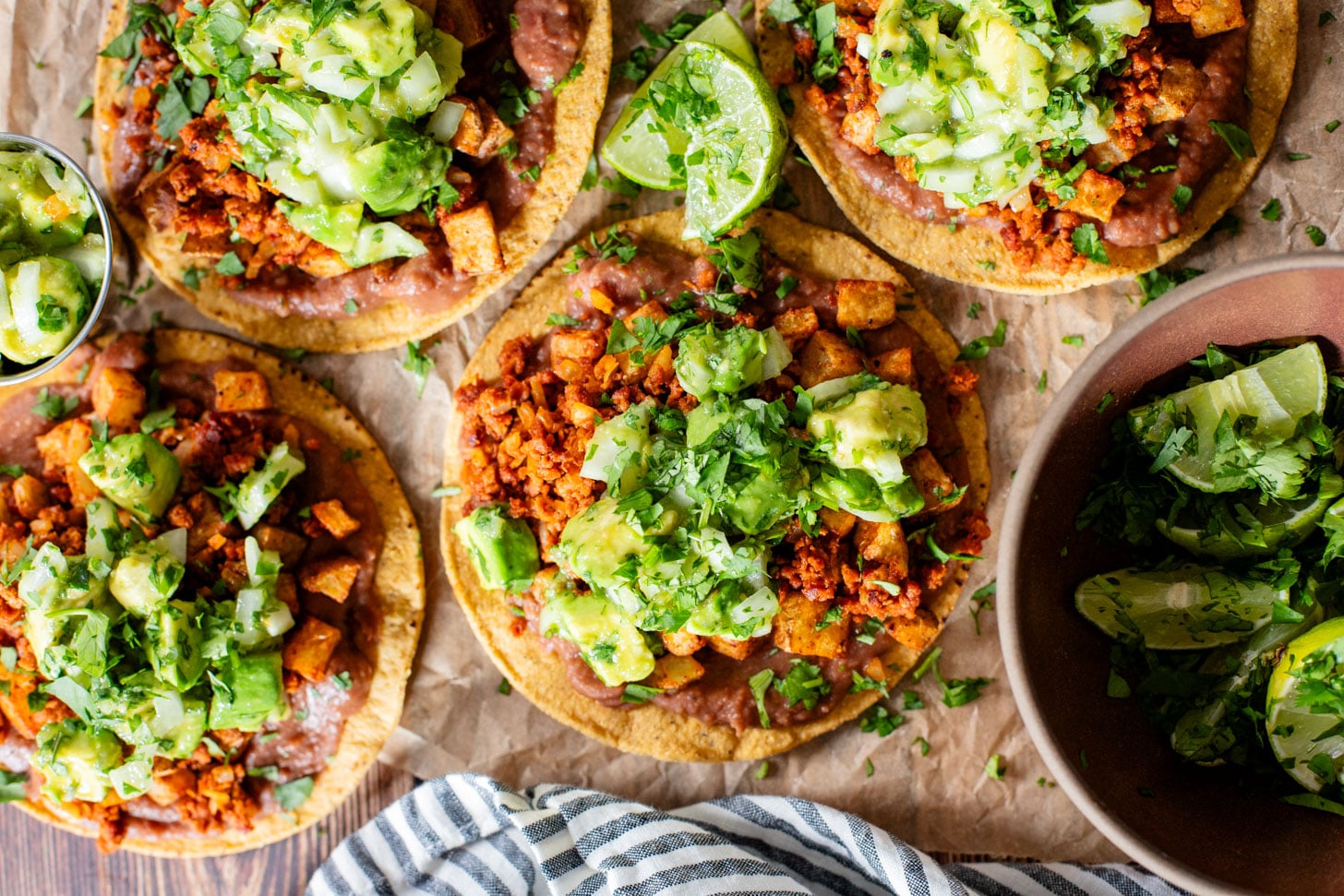 These Soy Chorizo & Potato Tostadas are made with refried beans, crispy potatoes, soyrizo and a salsa verde avocado salsa | ThisSavoryVegan.com #thissavoryvegan #vegantostadas #veganmexicanfood