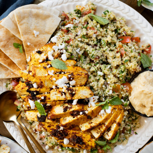 This Quinoa Tabbouleh with Baked Tofu is a high protein vegan recipe. Filled with healthy grains, fresh herbs & seasoned tofu | ThisSavoryVegan.com #thissavoryvegan #tabboulehsalad #highproteinvegan