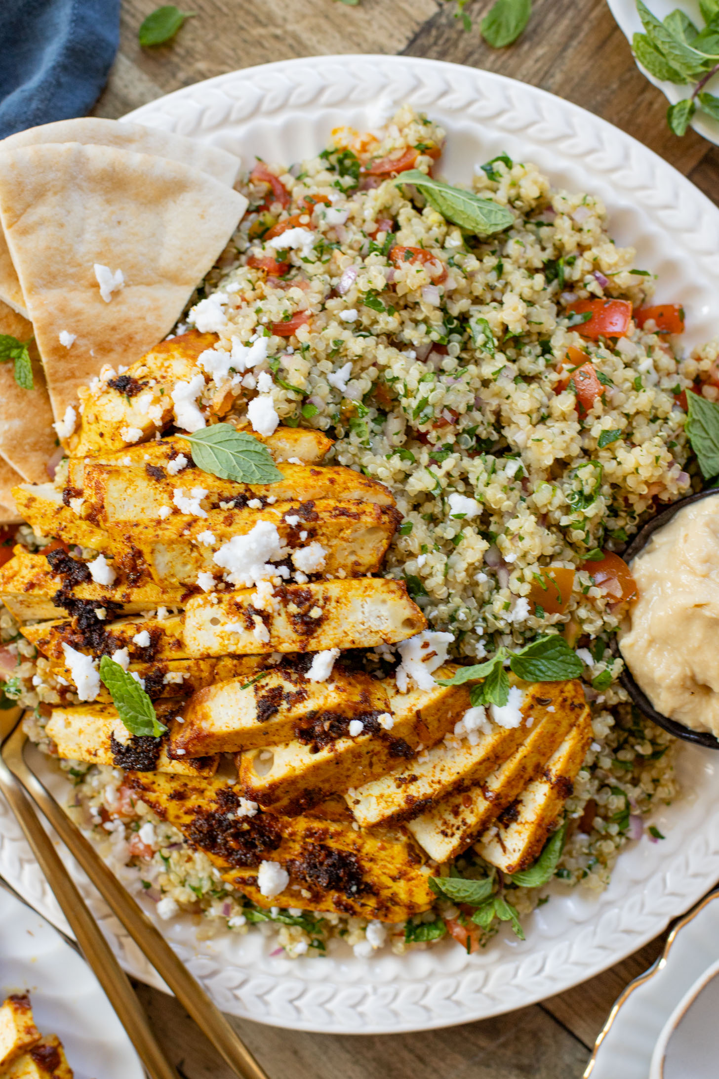 This Quinoa Tabbouleh with Baked Tofu is a high protein vegan recipe. Filled with healthy grains, fresh herbs & seasoned tofu | ThisSavoryVegan.com #thissavoryvegan #tabboulehsalad #highproteinvegan